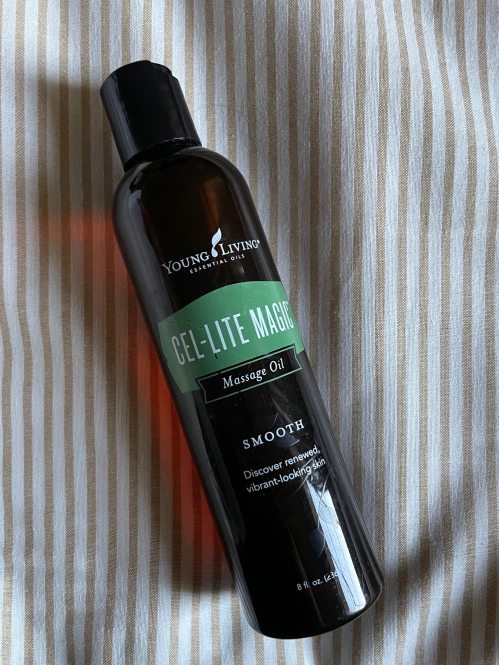 Young Living Cel-Lite Magic Massage Oil in Green and Black Bottle